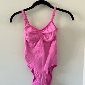 bright pink skims seamless sculpting bodysuit